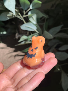Orange jack-o’-lantern frogs